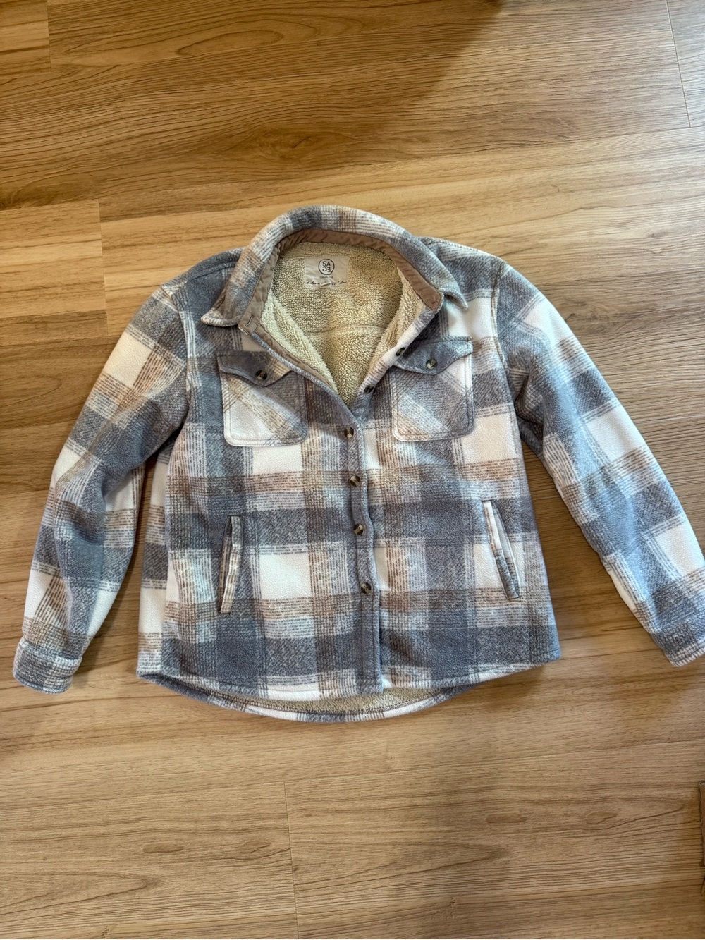 Sage Collective plaid sherpa-lined shacket in a grey and white pattern
